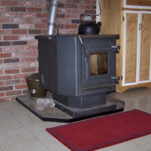 Pellet stove with kettle by Edgewise.